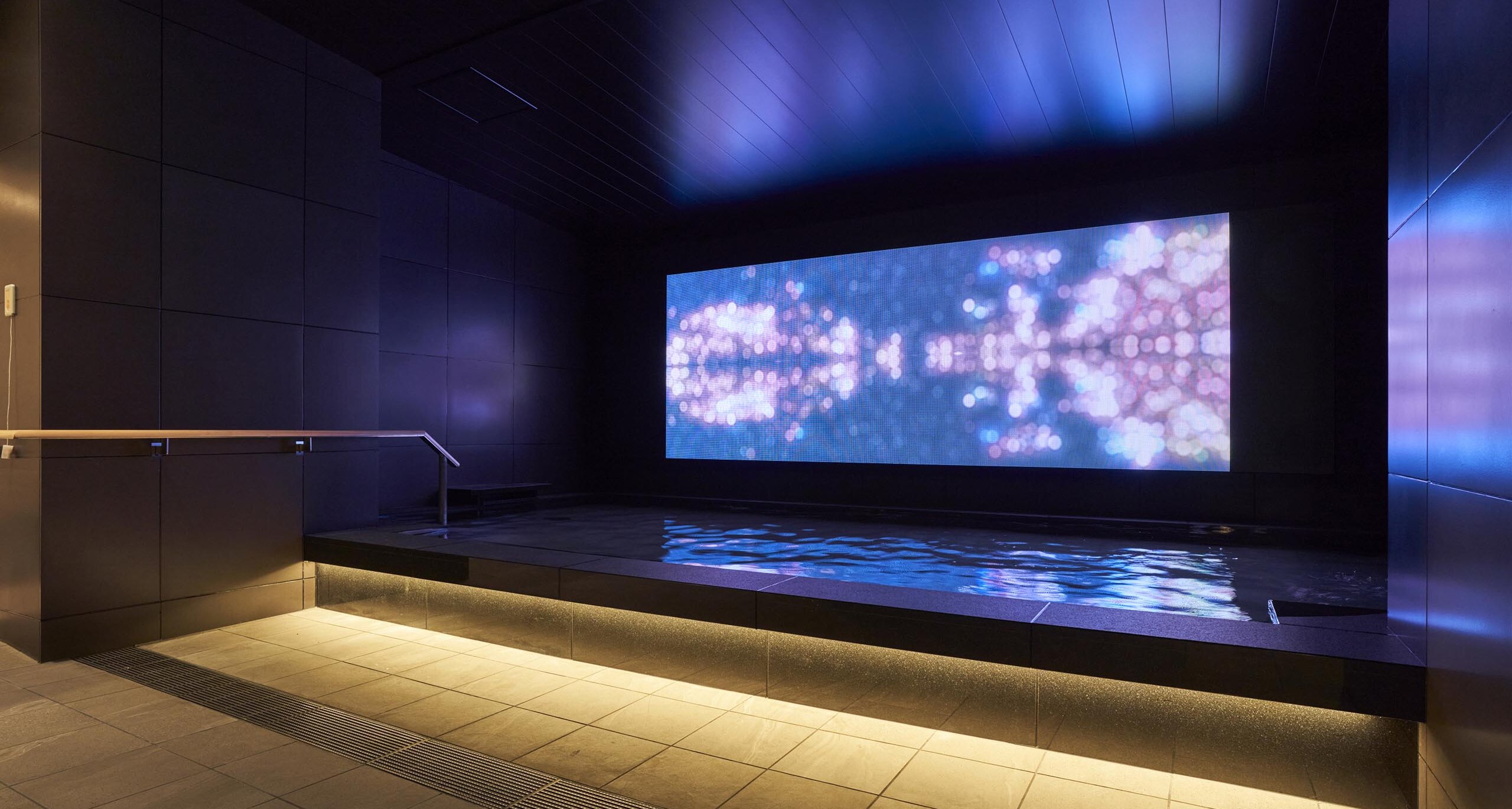 Digital art display in Cross Life Hakata Tenjin public bath — NATURAL HEALING installation