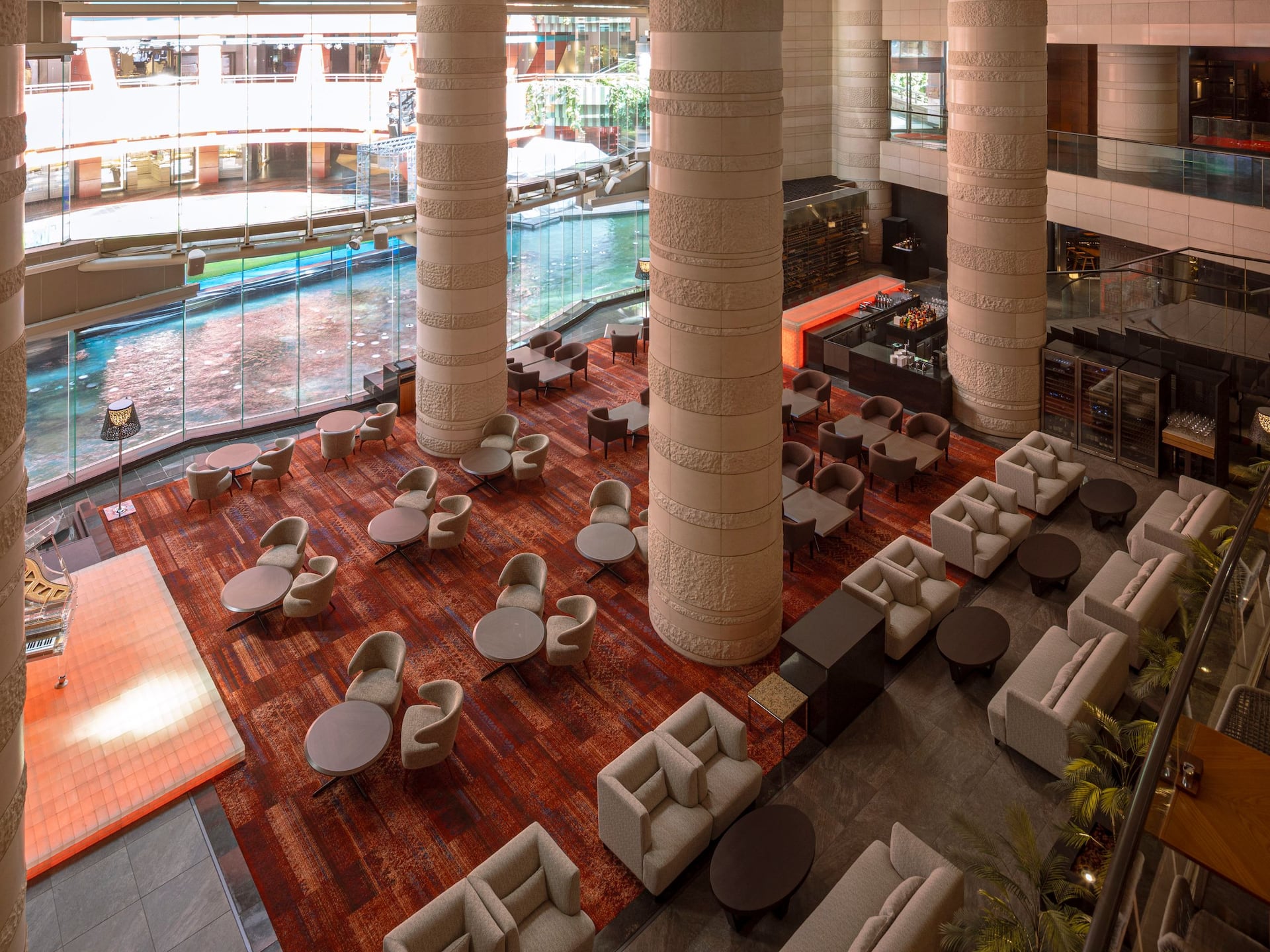 Bar Fizz daytime interior with panoramic windows overlooking Canal City's fountain