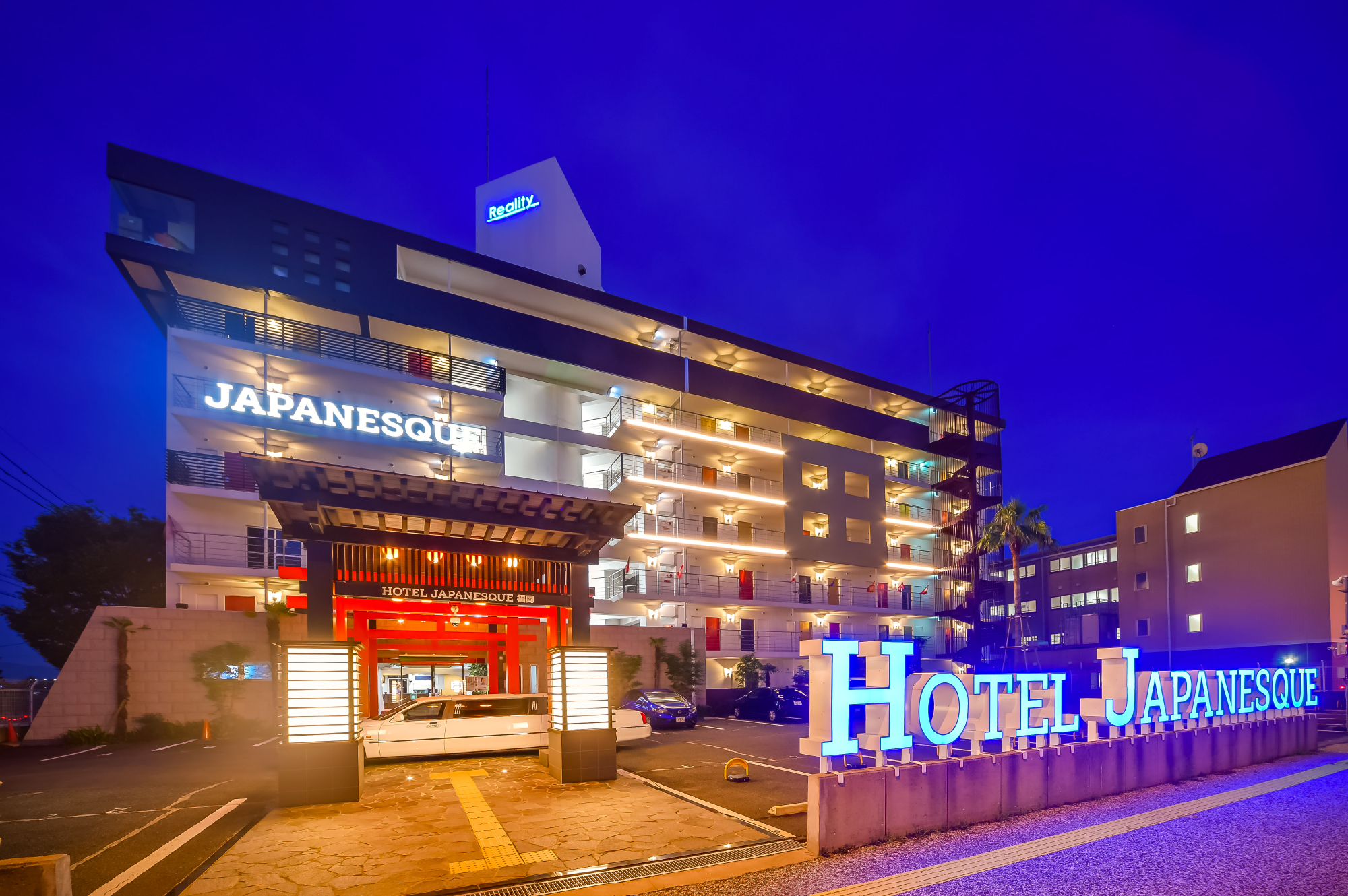Hotel Japanesque Fukuoka exterior at night with illuminated signage