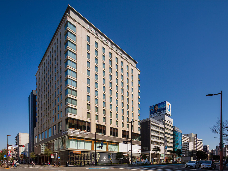 Hotel Monterey Fukuoka main building exterior on Watanabe-dori, Tenjin — full facade with hotel signage