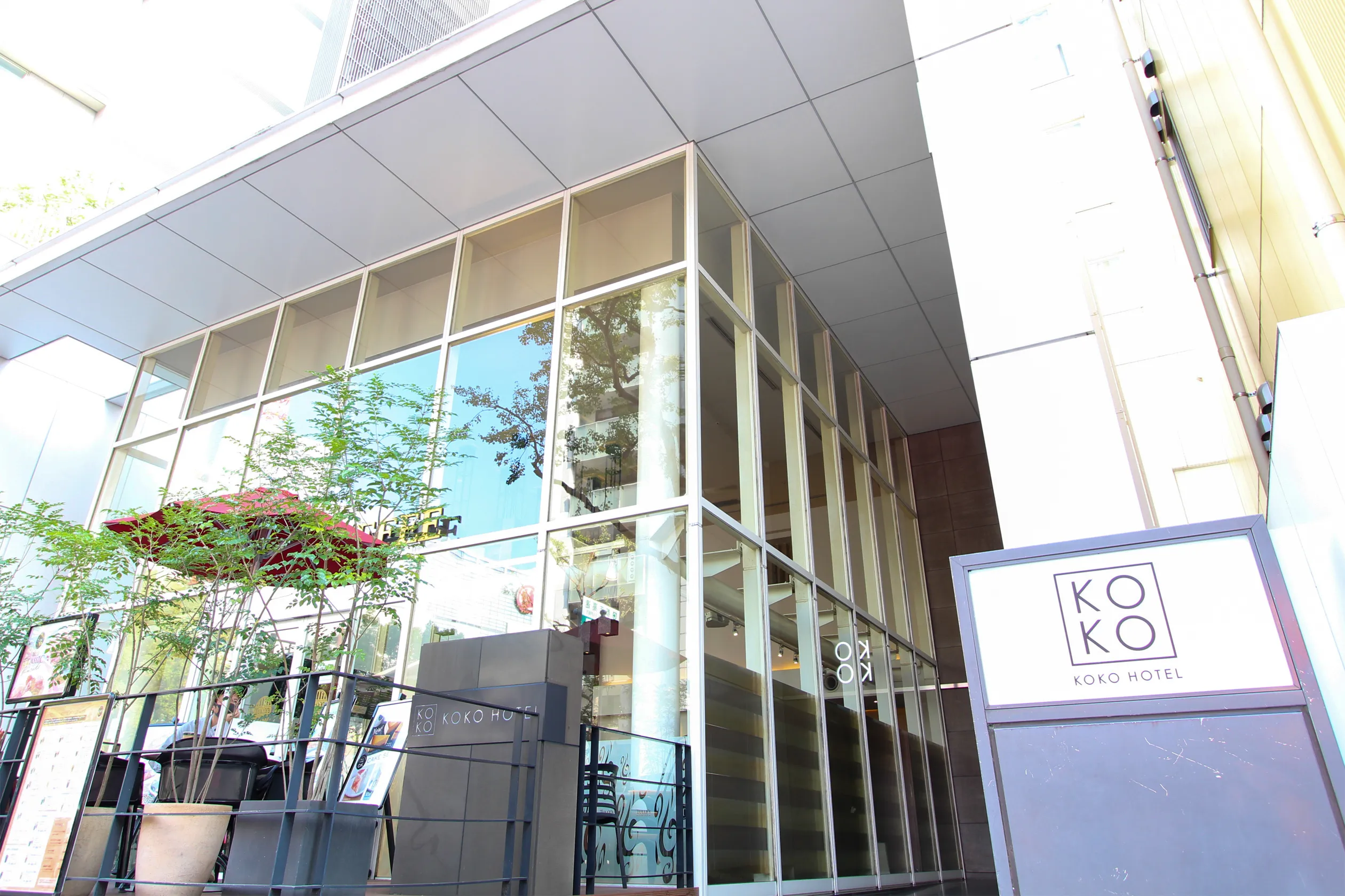 KOKO HOTEL Fukuoka Tenjin exterior entrance — glass-and-steel facade in Imaizumi, Chuo-ku, 4 minutes from Tenjin-Minami Station