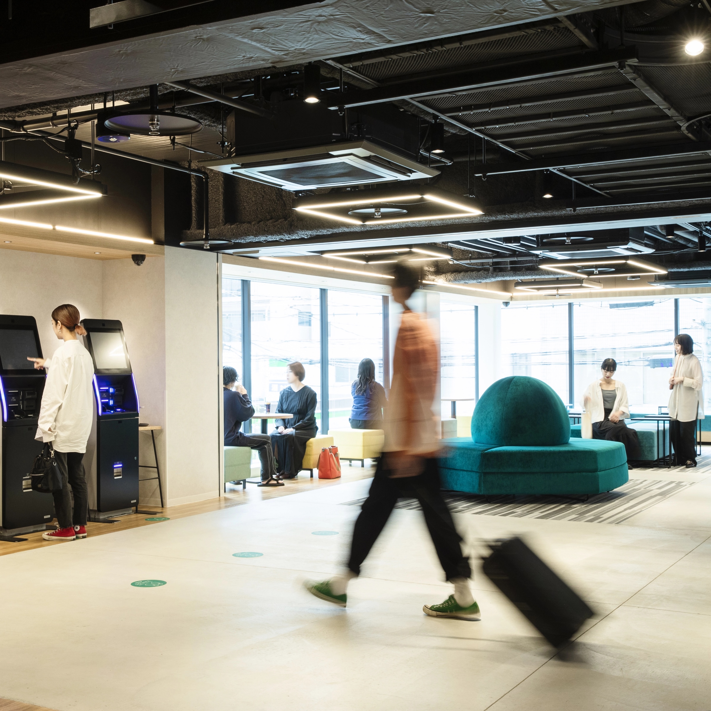 Prince Smart Inn Hakata ground-floor lounge with communal table and power outlets
