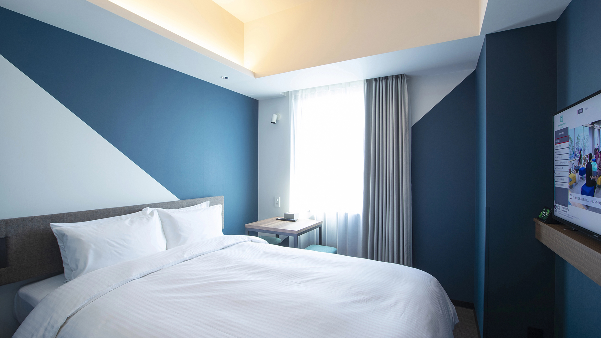 Prince Smart Inn Hakata Standard Double room (14 m²) with white bedding and wood-accented finish