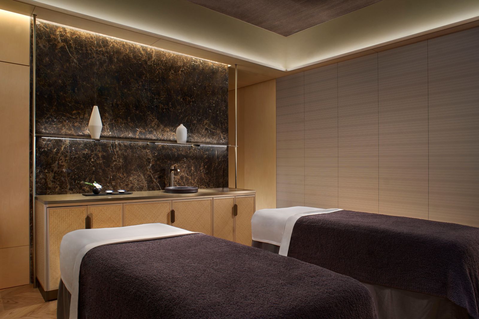The Ritz-Carlton Spa double treatment room with side-by-side massage tables and natural lighting