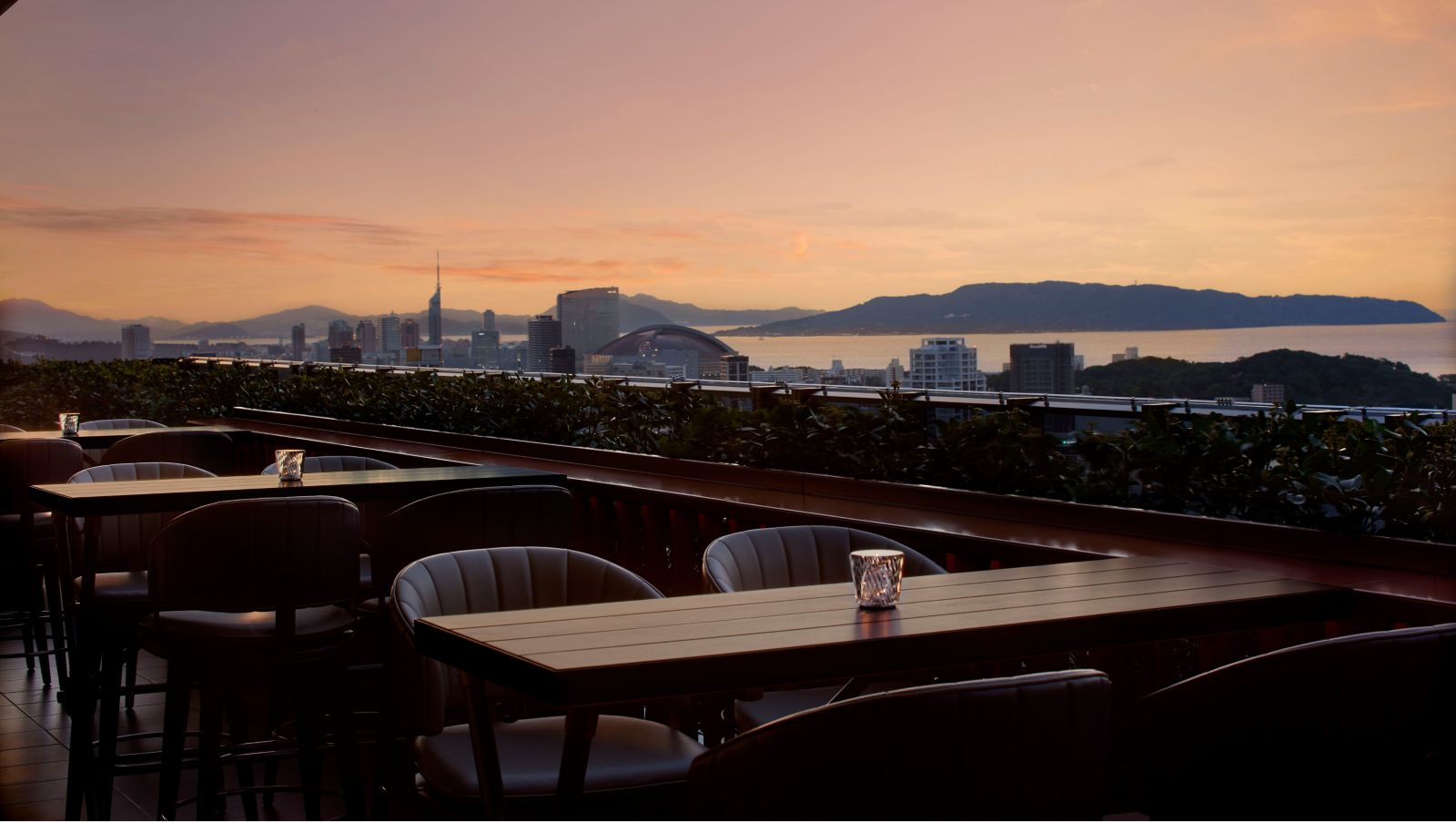 Bay bar outdoor terrace with al fresco seating overlooking Tenjin skyline