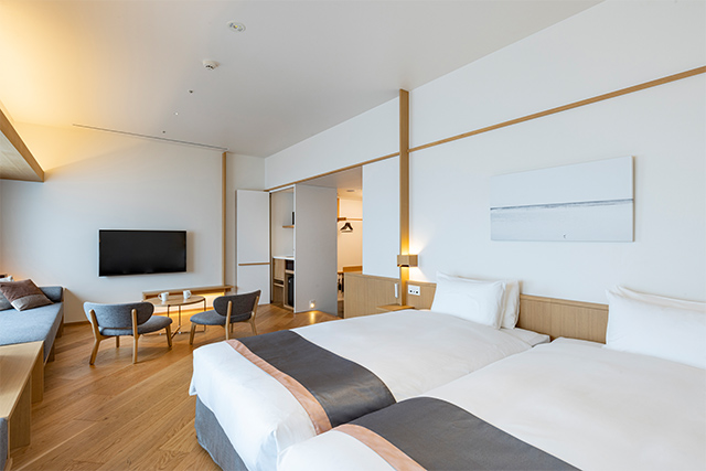 Room interior showing the in-room washer-dryer unit — Tokyu Stay's signature amenity
