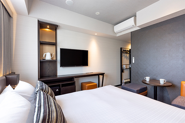 Tokyu Stay Hakata standard double room with TV shelf unit and side table